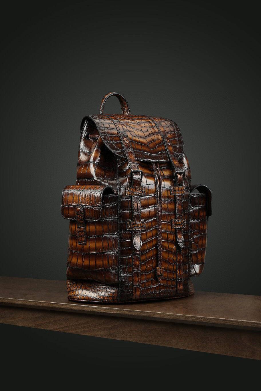 Genuine crocodile leather handbag by Rossie Viren featuring a sleek, structured design with top handle and adjustable shoulder strap.