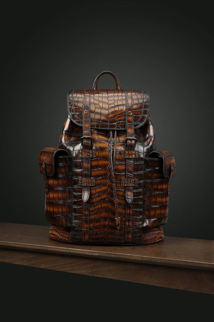 Genuine crocodile leather backpack handbag by Rossie Viren with a structured design and adjustable shoulder straps.