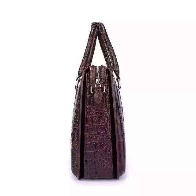 Genuine crocodile leather briefcase handbag by Rossie Viren, featuring a sleek design and textured crocodile pattern.