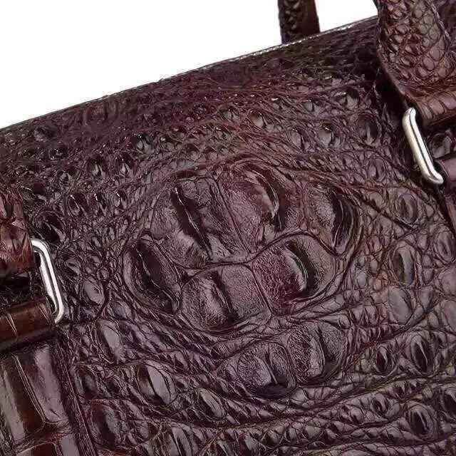 Genuine crocodile leather briefcase handbag by Rossie Viren with sleek design and textured crocodile pattern.