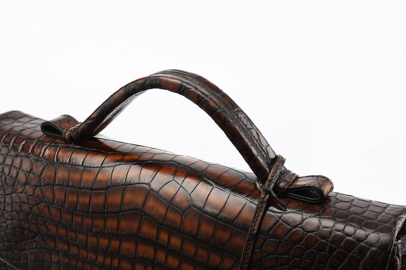 Vintage brown genuine crocodile leather briefcase handbag by Rossie Viren, featuring a sleek, structured design for business use.