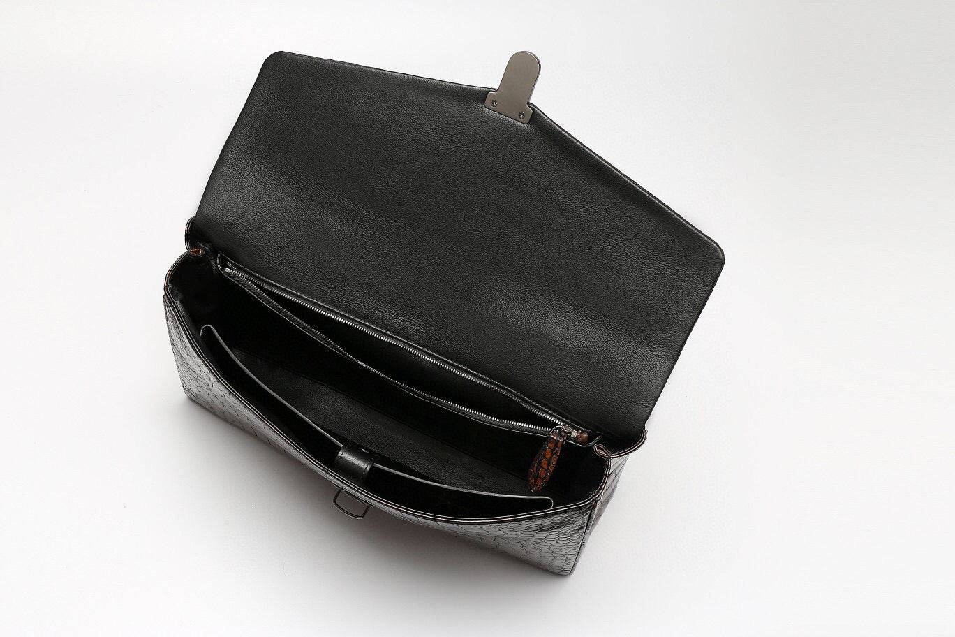Vintage brown crocodile leather briefcase by Rossie Viren, featuring a stylish handbag design with textured crocodile pattern.