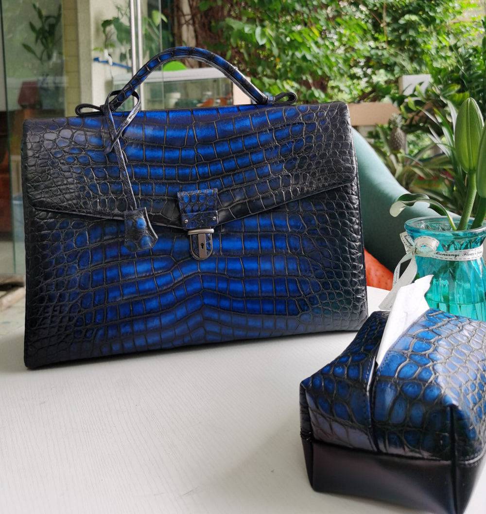Vintage brown crocodile leather briefcase by Rossie Viren, featuring a classic handbag design with a textured, luxurious surface.
