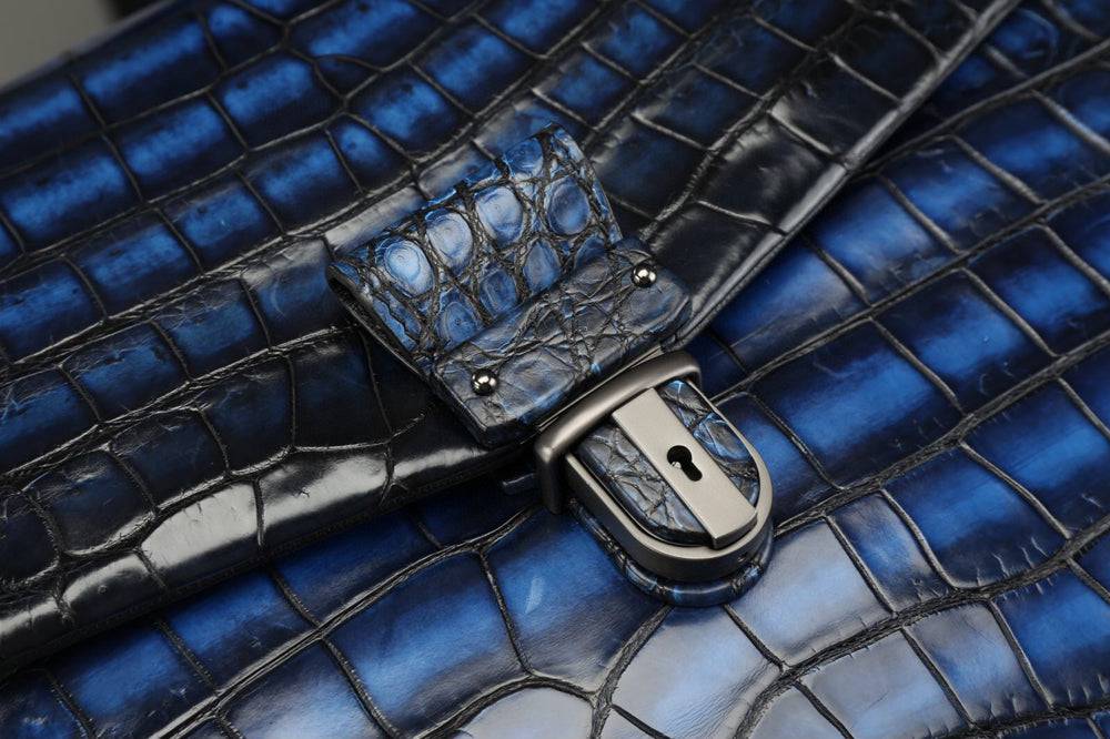 Vintage brown genuine crocodile leather briefcase by Rossie Viren, showcasing a sleek, professional handbag with textured leather details.