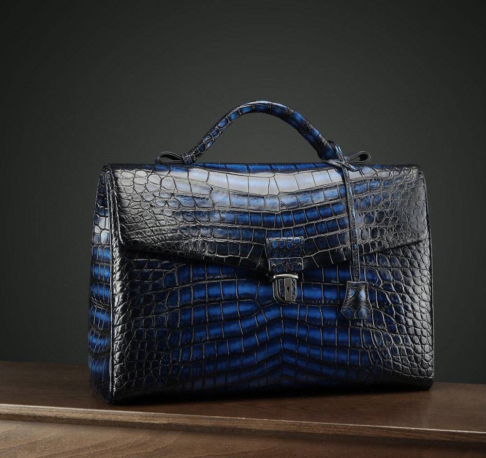 Vintage brown Crocodile Leather briefcase by Rossie Viren, showcasing a stylish handbag with textured crocodile pattern and sturdy handle.
