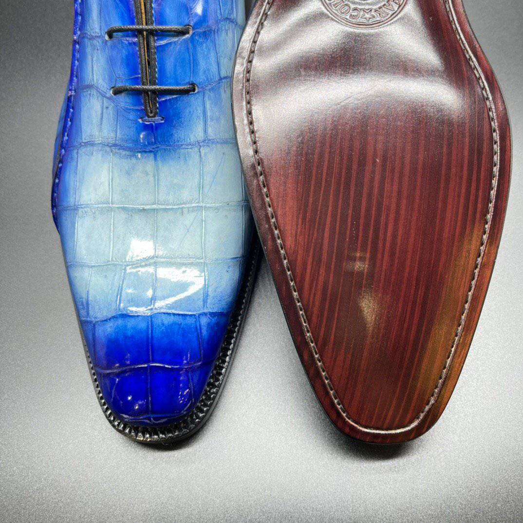 Genuine crocodile leather men's penny loafers by Rossie Viren in hand-painted two-tone blue with sleek dress shoe design.