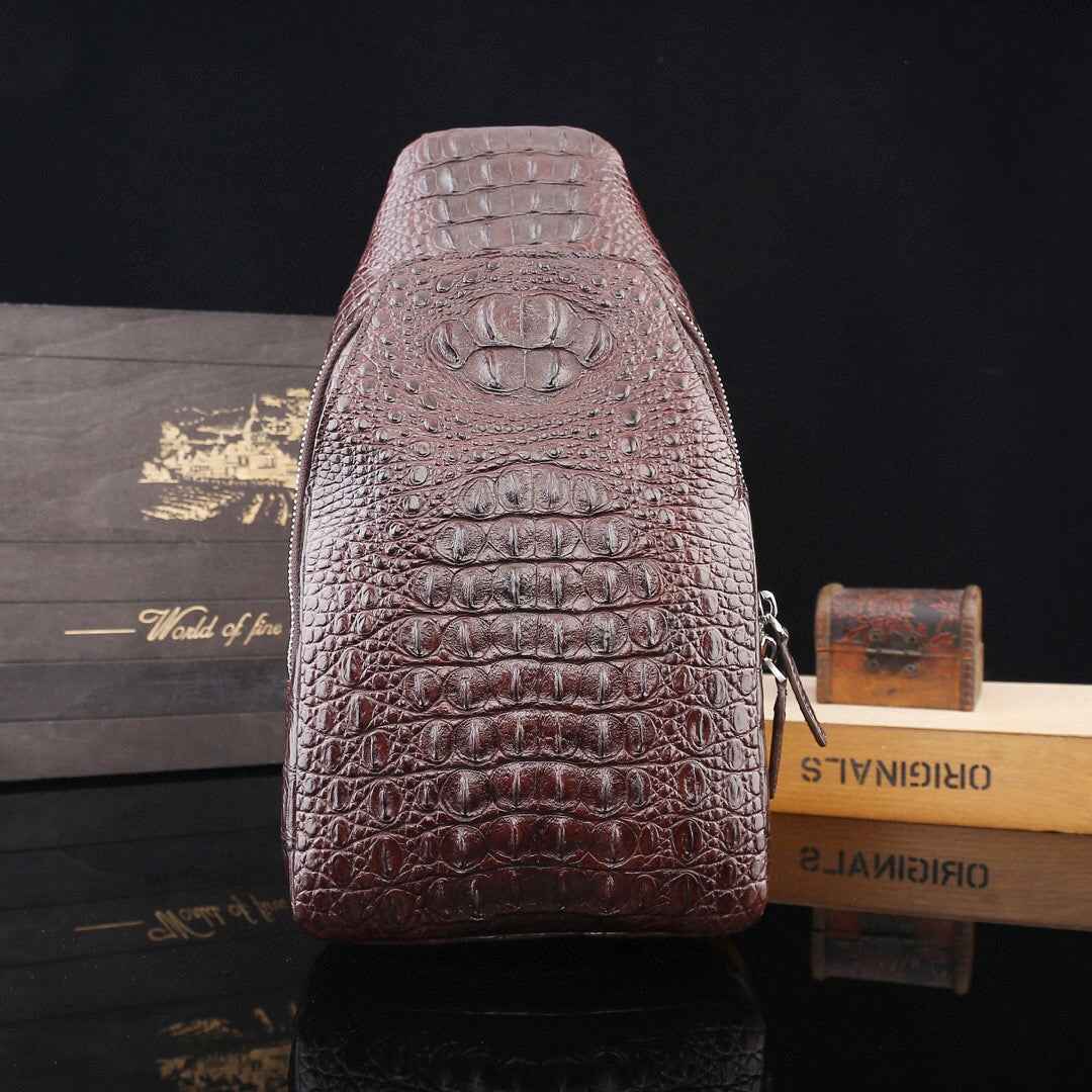 Genuine crocodile leather men's sling chest bag by Rossie Viren, featuring a sleek design with adjustable strap and textured crocodile pattern.