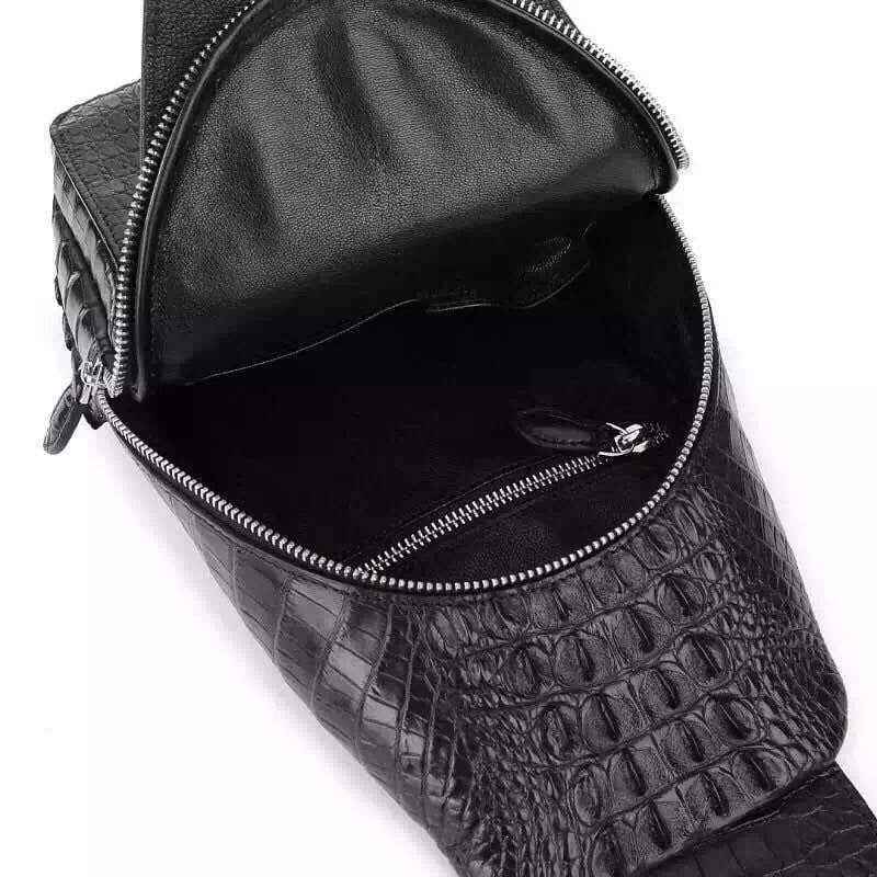 Genuine crocodile leather men's sling chest bag by Rossie Viren with adjustable strap and textured crocodile pattern.