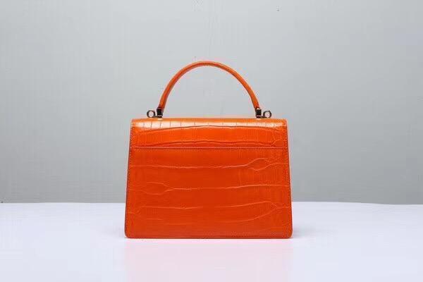 Orange genuine crocodile leather handbag with top handle and crossbody strap by Rossie Viren.