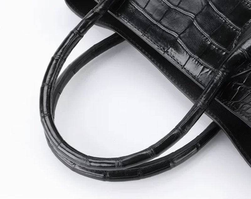 Black genuine crocodile leather top handle handbag with shoulder strap, tote, and messenger bag features, 30cm size by Rossie Viren.