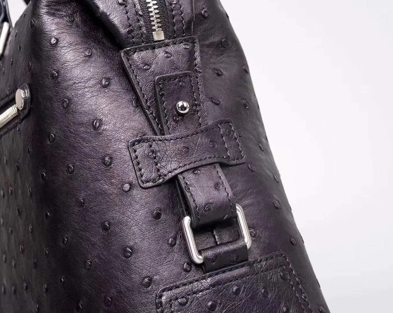 Black genuine ostrich leather briefcase tote bag by Rossie Viren, showcasing a sleek and textured professional accessory.