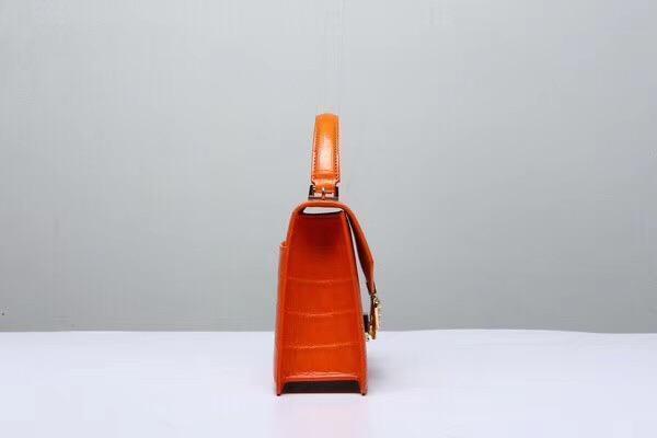 Genuine orange Siamese crocodile leather handbag with top handle and shoulder strap by Rossie Viren.