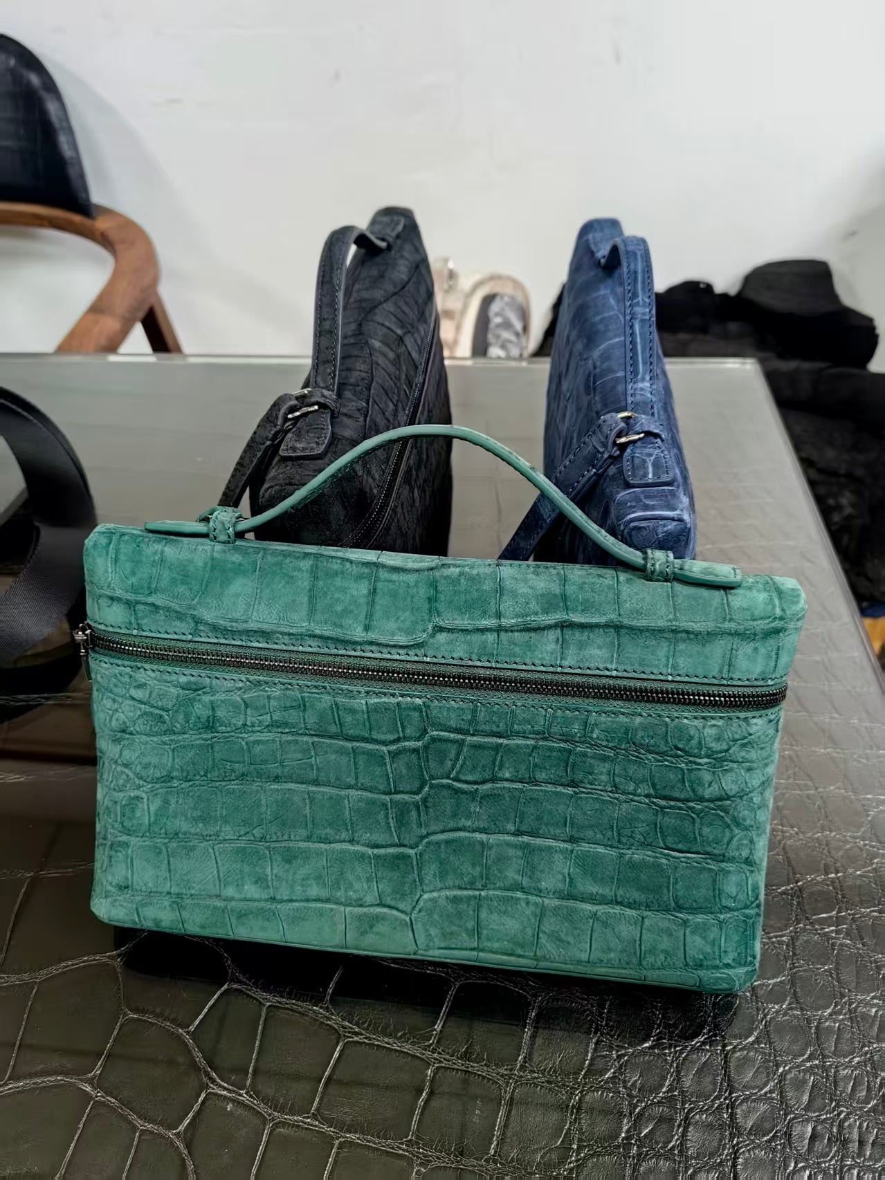 Green Rossie Viren unisex crocodile skin leather clutch bag with zipper handle and sleek design, made from genuine nubuck leather.