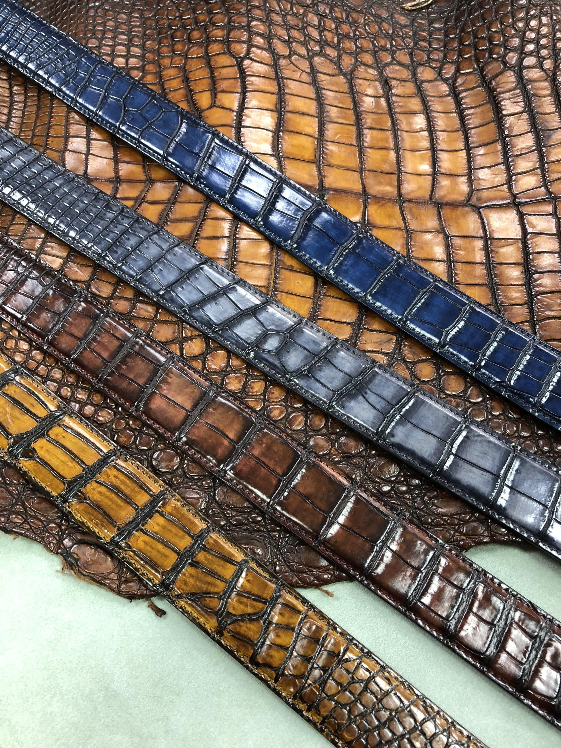 Hand-painted genuine crocodile leather belt by Rossie Viren featuring textured, high-quality craftsmanship and a sleek design.