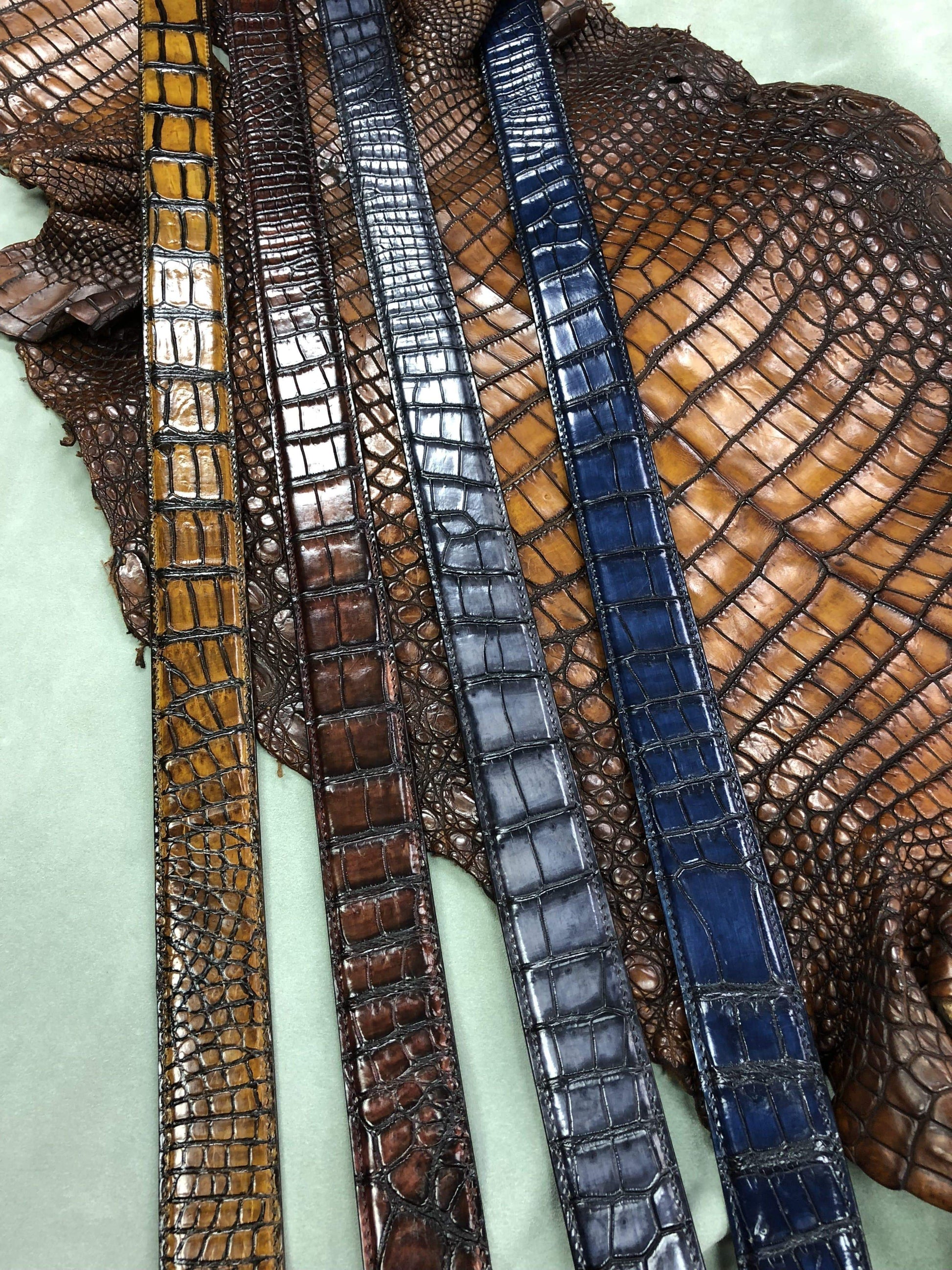 Hand-painted genuine crocodile leather belt by Rossie Viren, showcasing detailed craftsmanship and luxurious texture.