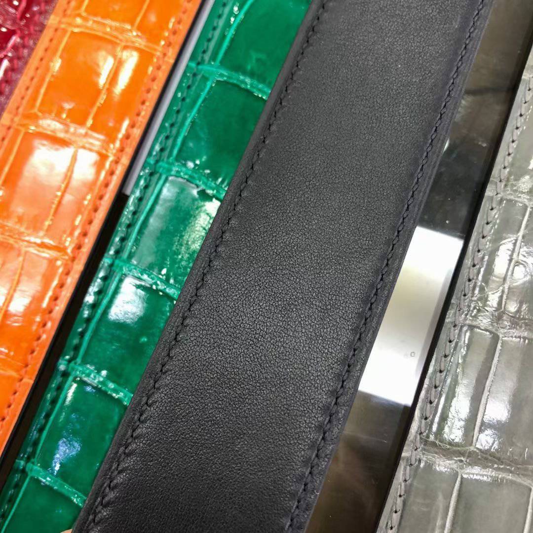 High shiny Nile crocodile skin leather belt by Rossie Viren, featuring a luxurious textured crocodile pattern and polished finish.