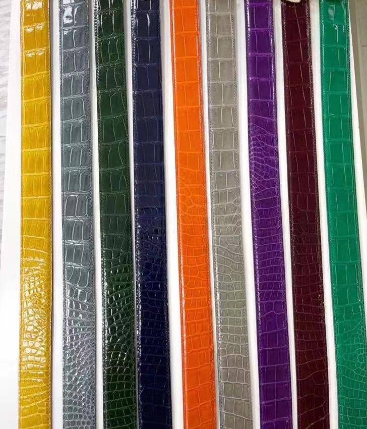 Shiny Nile crocodile skin leather belt by Rossie Viren, featuring a polished finish and elegant crocodile pattern.