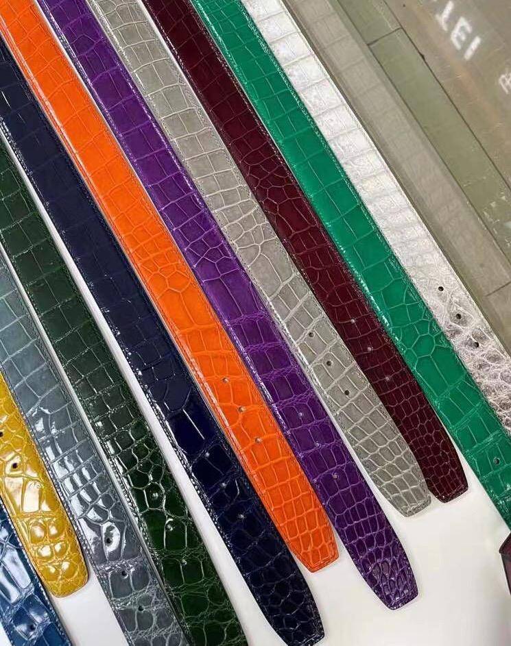 High shiny Nile crocodile skin leather belt by Rossie Viren, showcasing glossy crocodile texture and elegant craftsmanship.