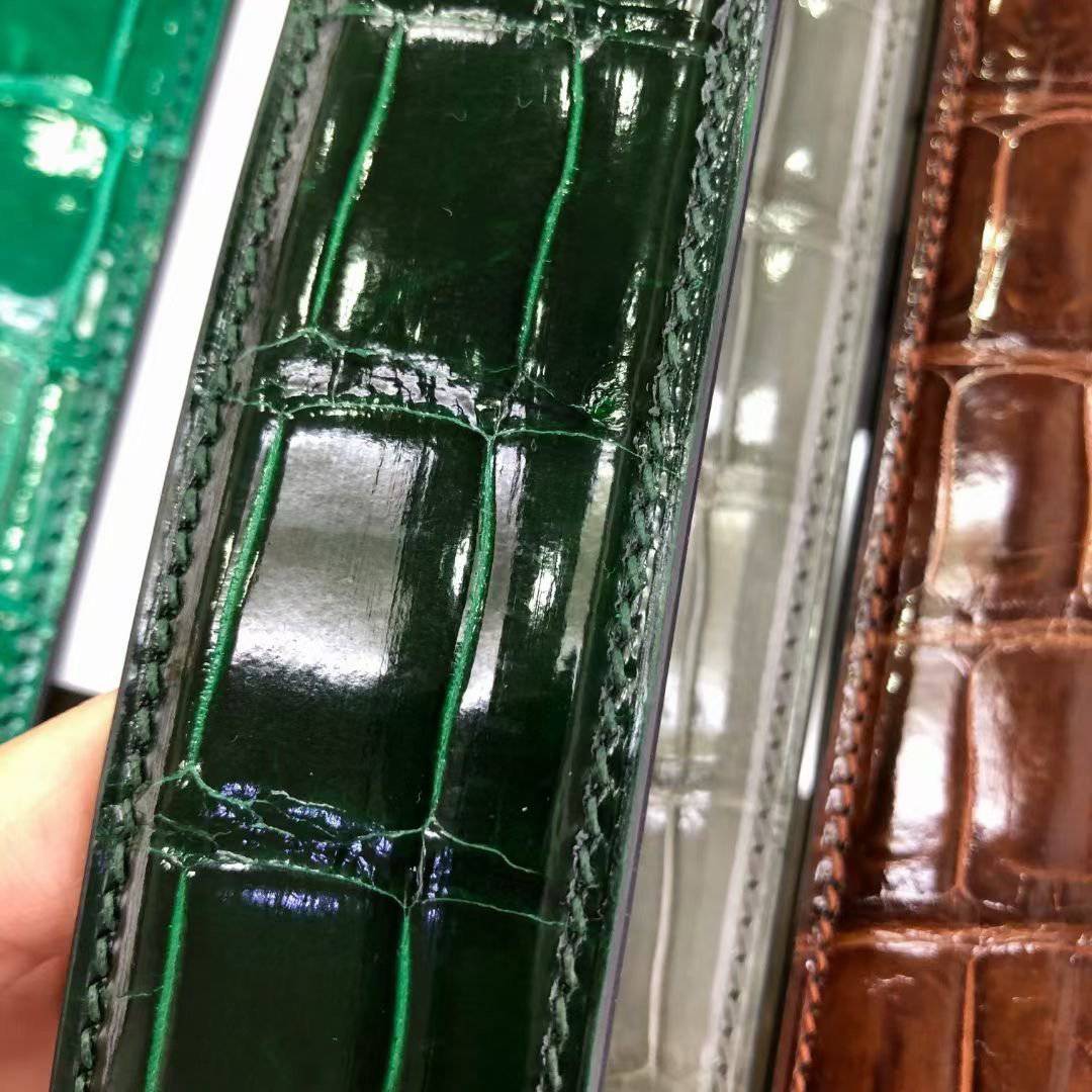 High shiny Nile crocodile skin leather belt by Rossie Viren, featuring a polished, textured crocodile pattern and sleek design.