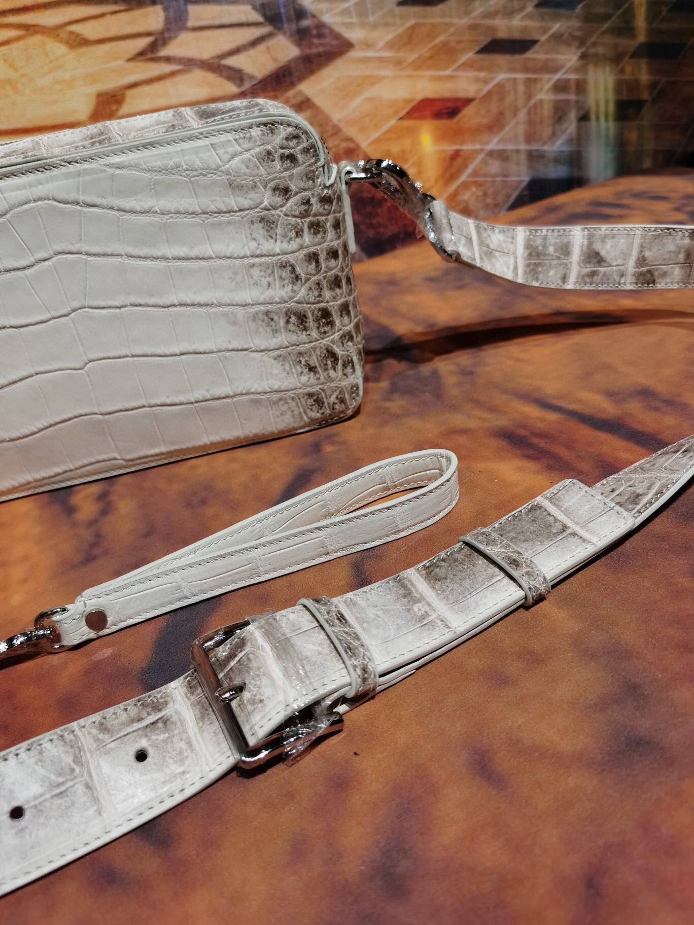 Rossie Viren Himalaya White genuine crocodile leather backpack with shoulder, chest, and crossbody styles featuring a sleek clutch design.