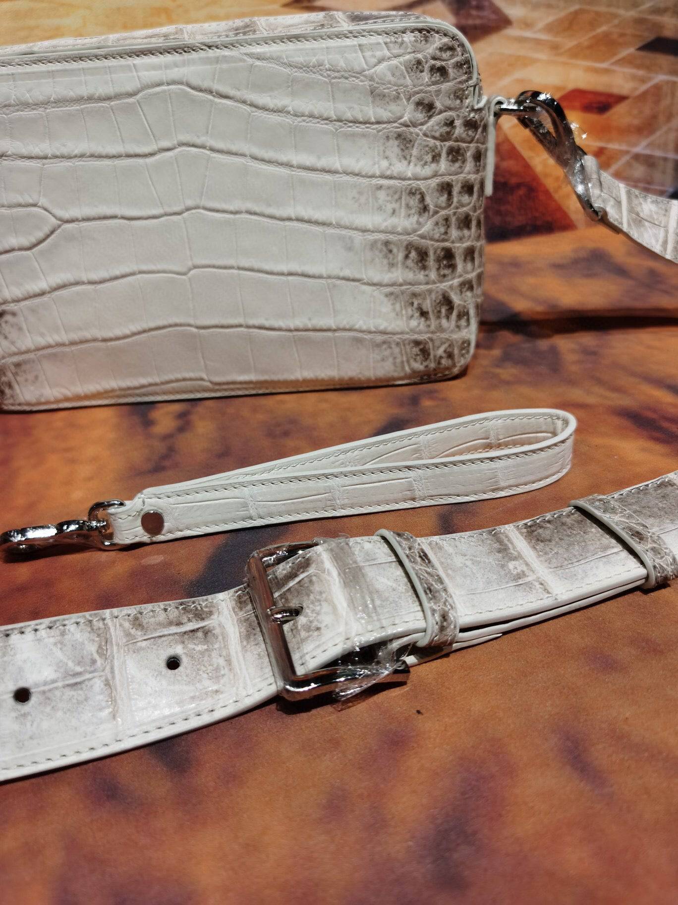 Rossie Viren Himalaya White genuine crocodile leather backpack with shoulder and cross-body strap, stylish clutch bag design.