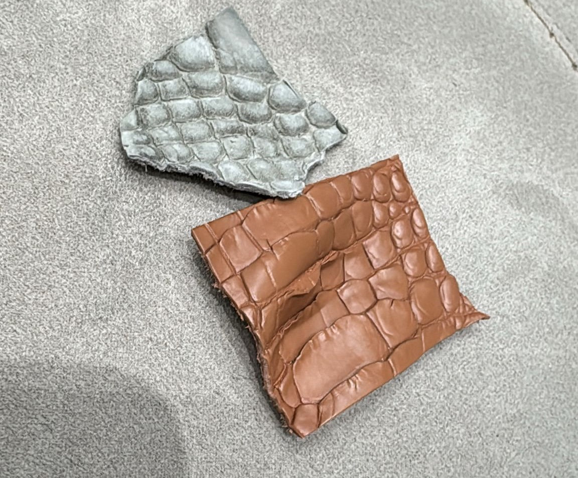 Rossie Viren brown and grey nubuck crocodile skin leather blazer jacket on a hanger, showcasing textured leather and tailored fit.