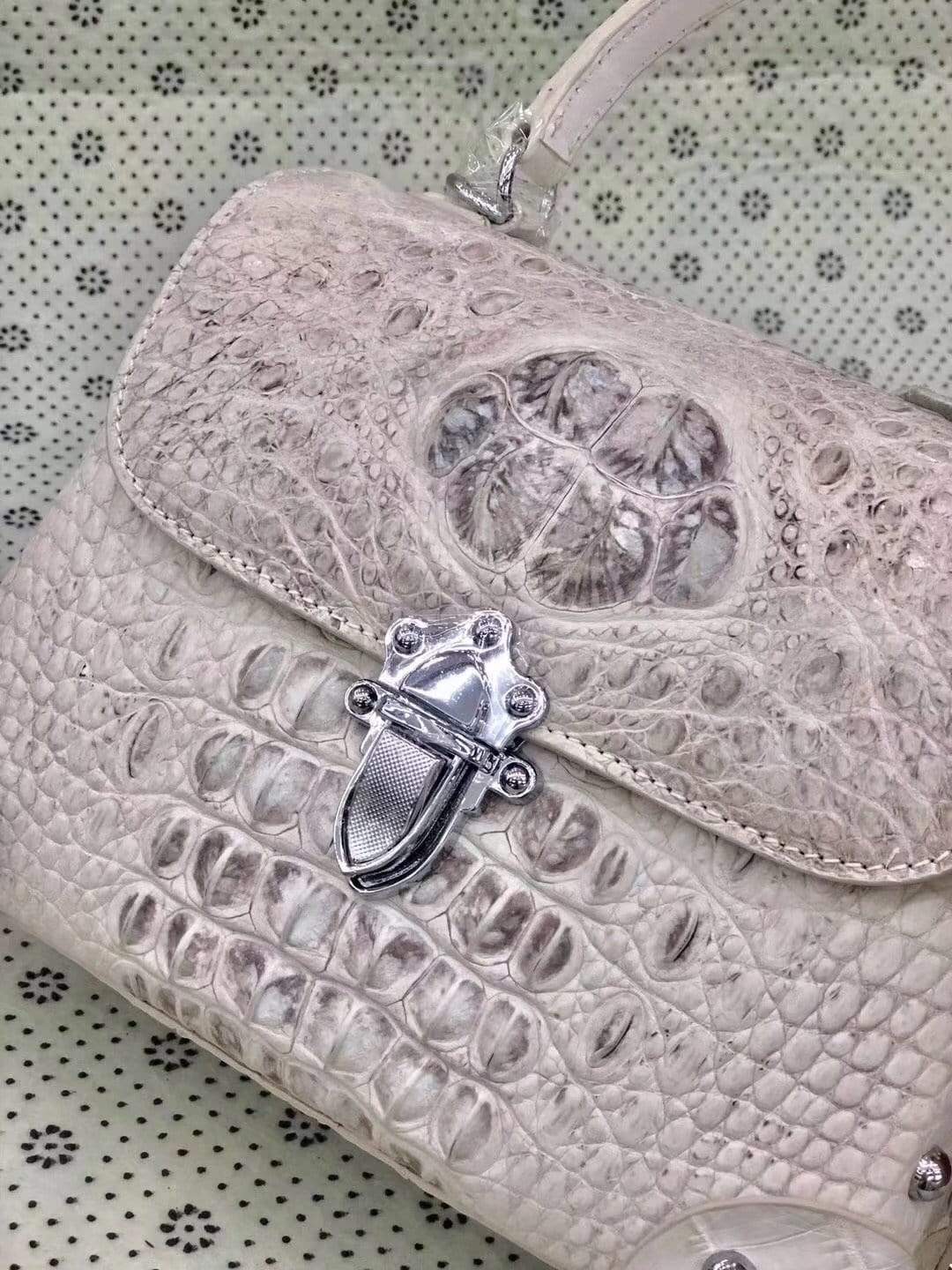Rossie Viren ladies top-handle handbag in genuine crocodile leather with crossbody strap and messenger bag style.