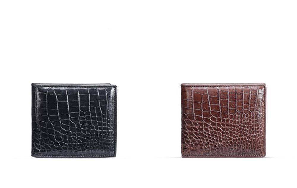 Men's bifold leather wallet by Rossie Viren with genuine crocodile and belly leather, showcasing the sleek design and textured surface.