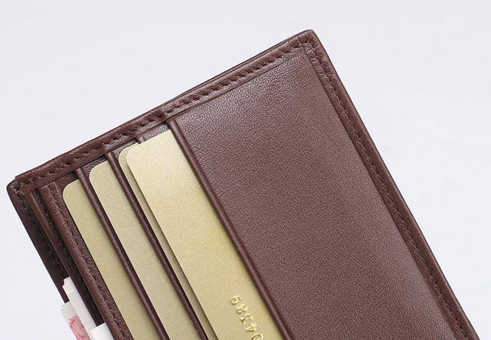 Men's bifold leather wallet by Rossie Viren, crafted from genuine crocodile belly leather with a sleek, premium finish.