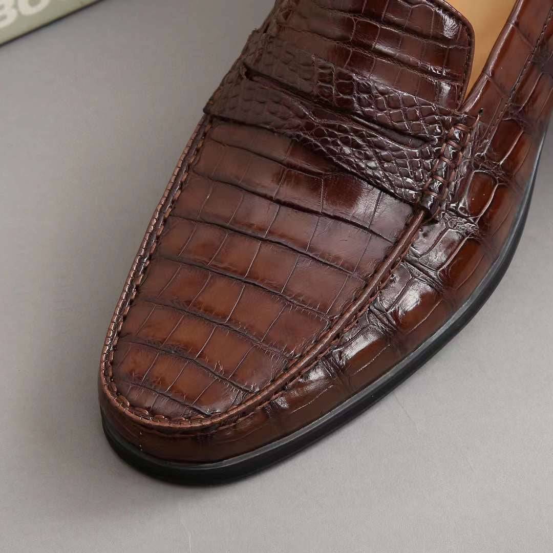 Men's crocodile leather slip-on loafers by Rossie Viren, showcasing polished crocodile shoes with sleek slip-on style.