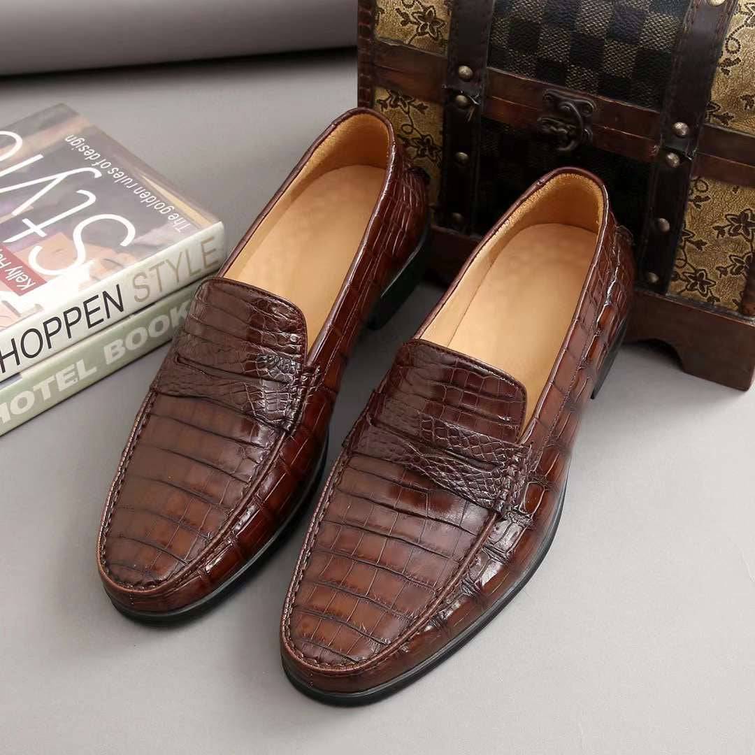 Men's Rossie Viren crocodile leather slip-on loafers featuring a sleek design and textured crocodile pattern.