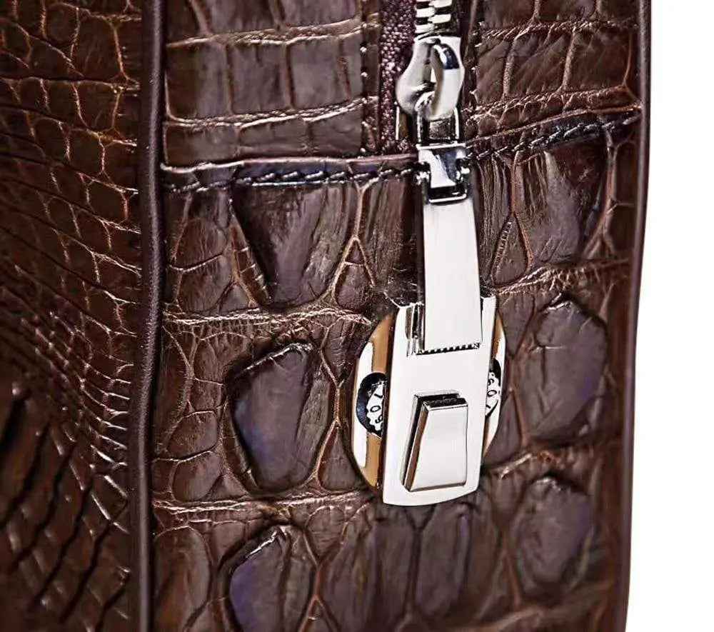 Men's genuine crocodile leather briefcase by Rossie Viren with laptop compartment and passcode lock, showcasing sleek business style.