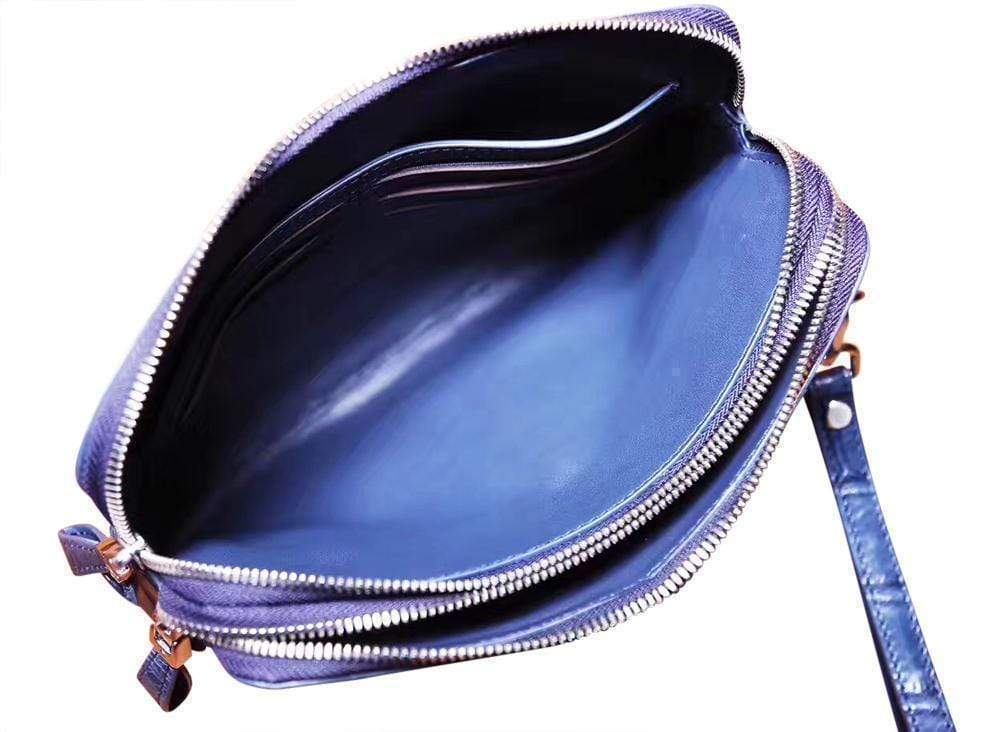Men's genuine crocodile leather clutch bag by Rossie Viren with double zip closure and sleek design.