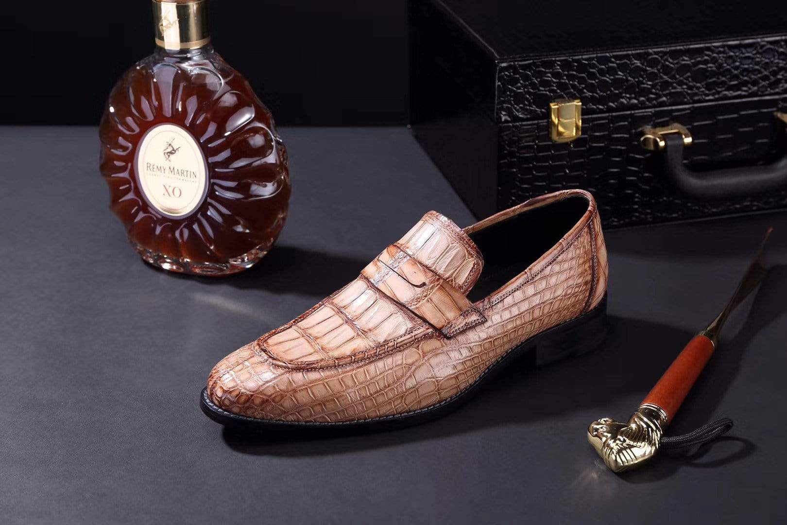 Men's crocodile leather penny loafer shoes by Rossie Viren, showcasing polished crocodile pattern and classic slip-on design.