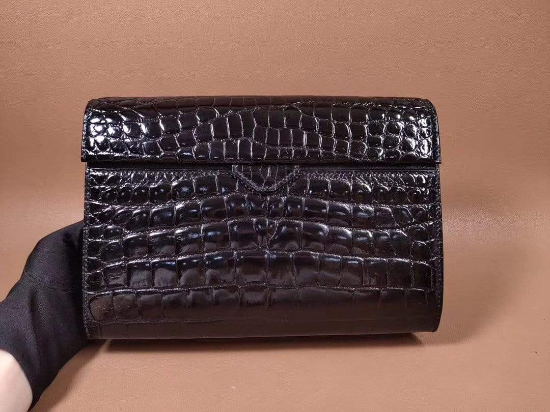 Black men's clutch bag made of genuine crocodile leather with a high-gloss finish and beaded details by Rossie Viren.
