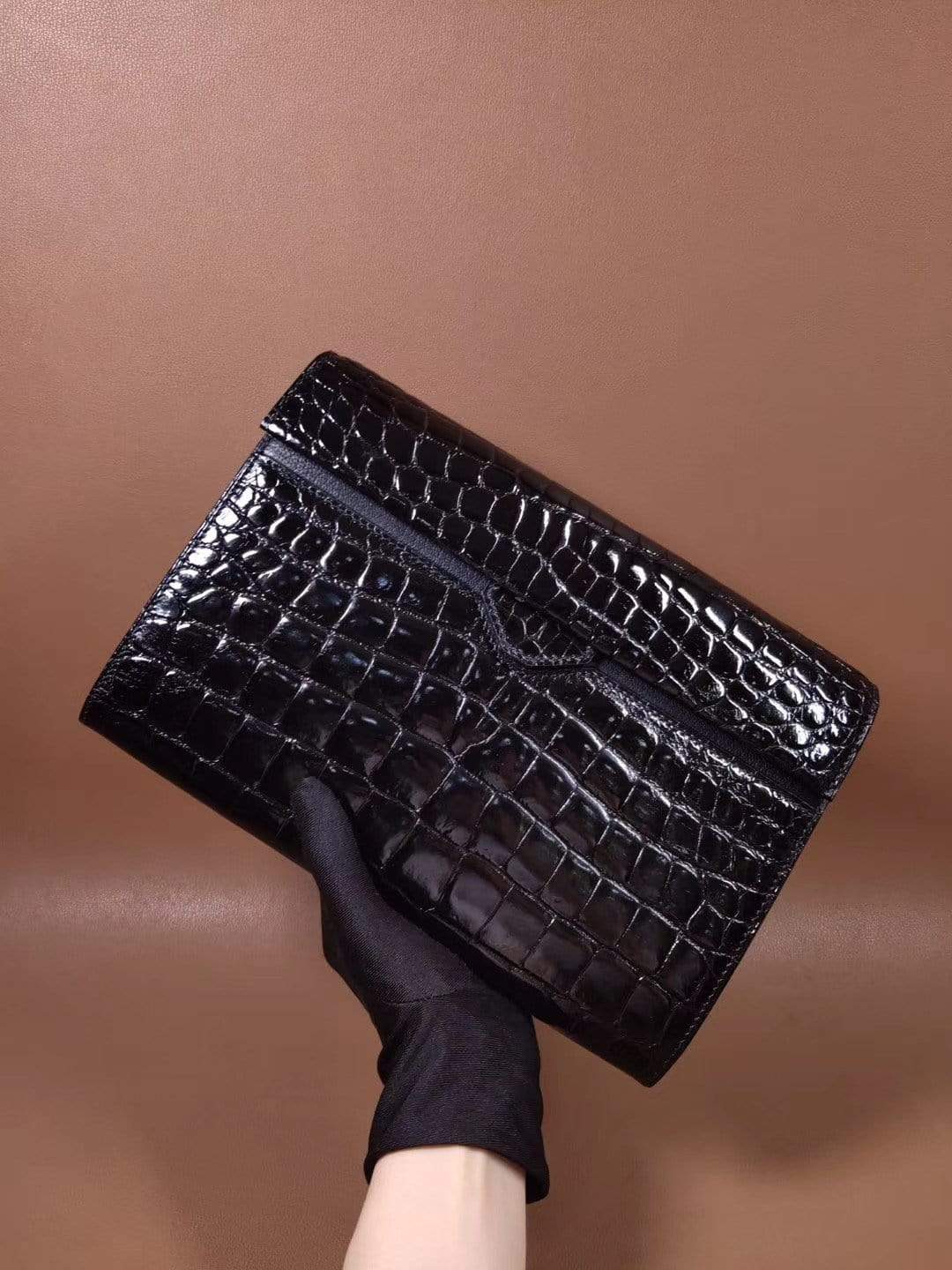 Men's black crocodile leather clutch bag with high gloss finish and beaded detail by Rossie Viren.