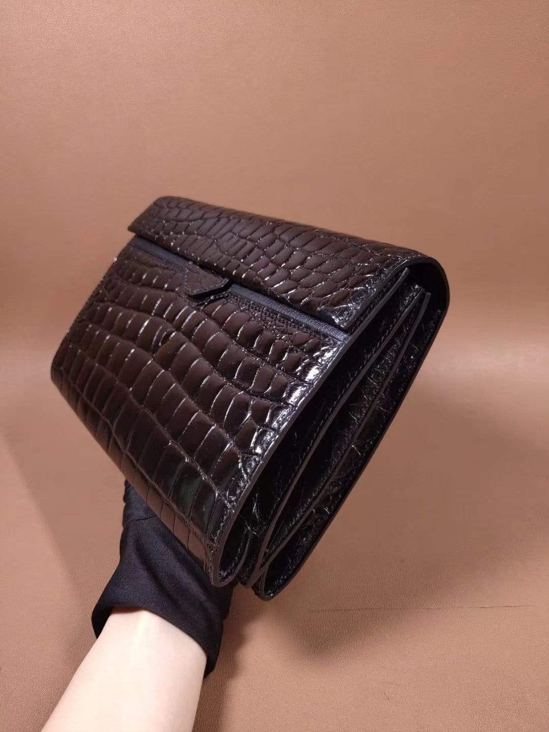 Mens black genuine crocodile leather clutch bag with high-gloss finish and beaded details, stylishly designed by Rossie Viren.