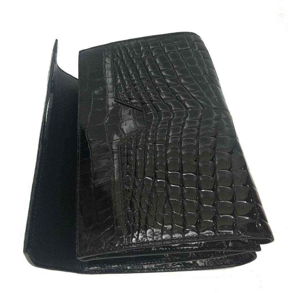 Men's black genuine crocodile leather clutch bag with high gloss finish and beaded details by Rossie Viren.