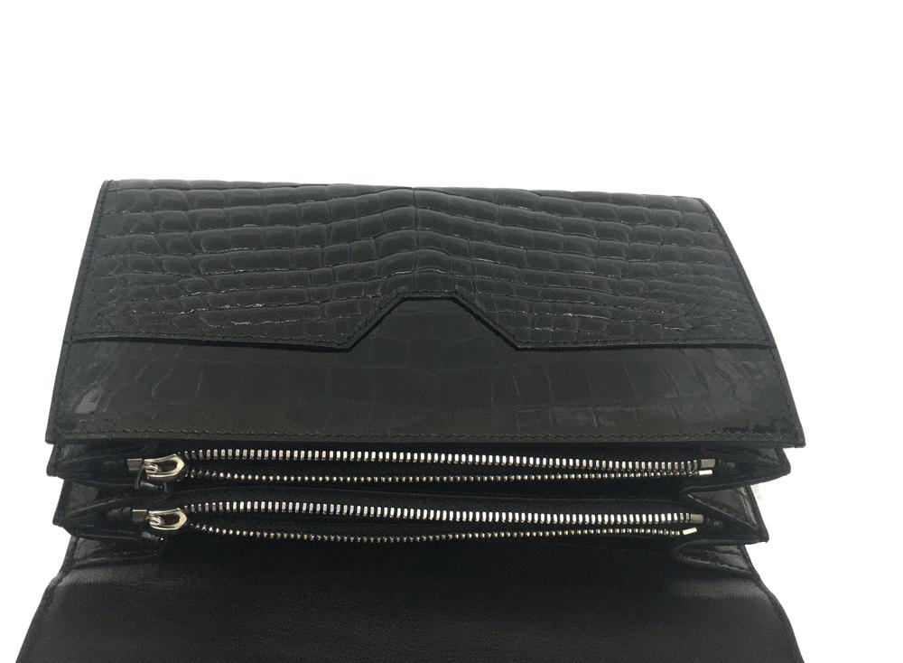 Men's genuine crocodile leather clutch bag by Rossie Viren featuring a high-gloss finish and beaded details in black.