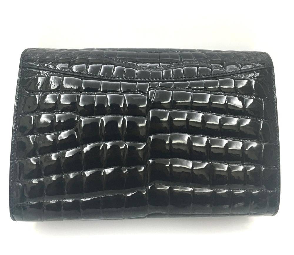 Mens black genuine crocodile leather clutch bag with high gloss finish and beaded details by Rossie Viren.