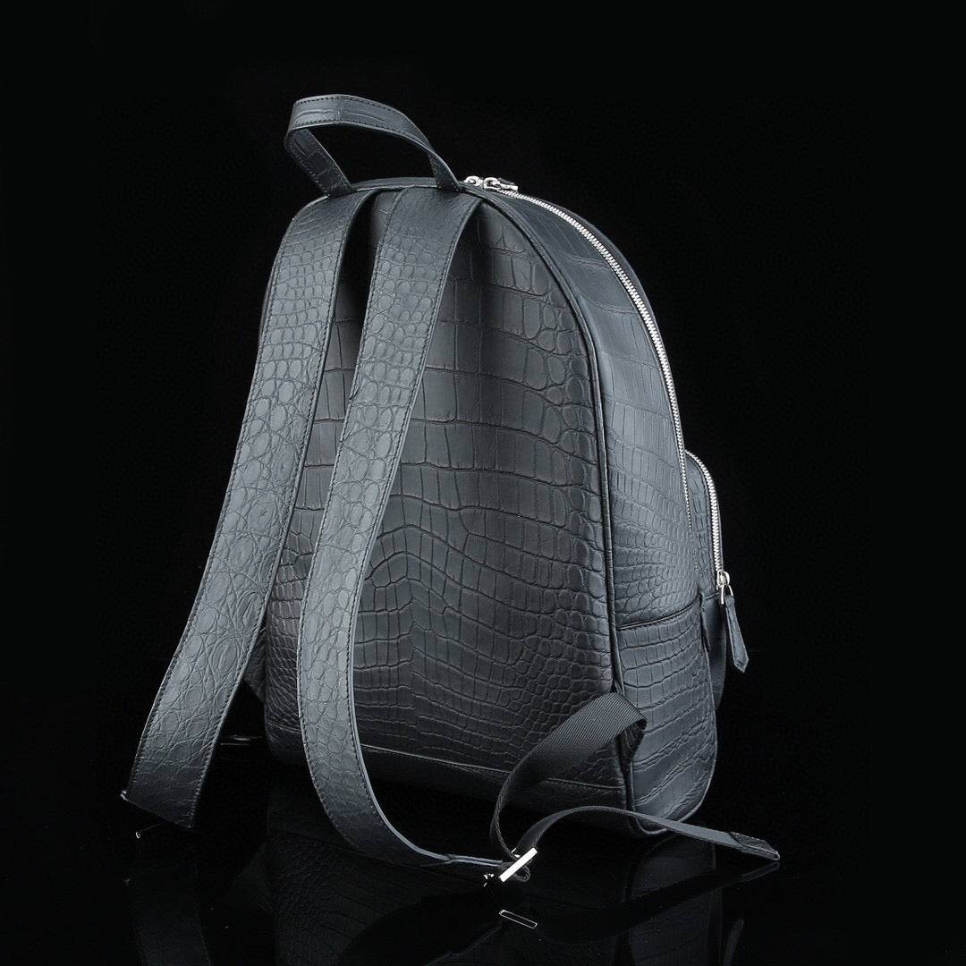 Large black crocodile leather backpack by Rossie Viren, featuring a matte finish and sturdy straps for men's fashion.