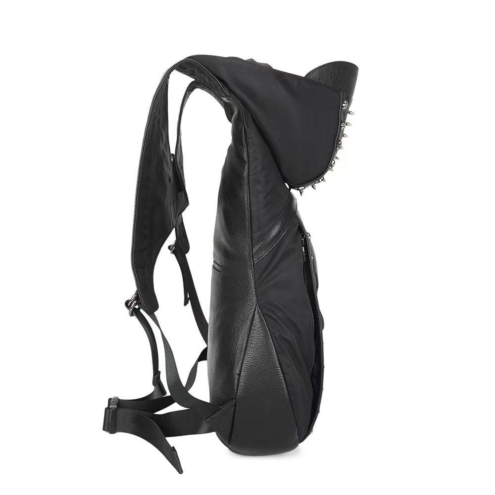 Rossie Viren men's 3D studded smiling skull hooded backpack, large messenger bag with bold, edgy design and padded straps.