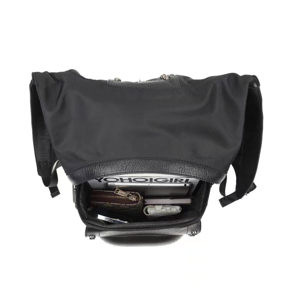 Large 3D messenger backpack by Rossie Viren with a studded smiling skull design and hooded style for men.