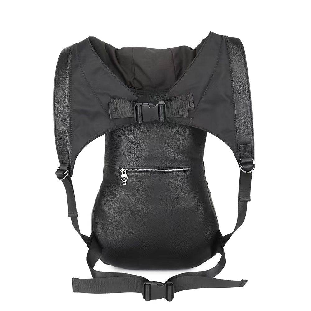 Mens 3D studded smiling skull hooded backpack by Rossie Viren, large messenger bag with bold skull design and hooded feature.
