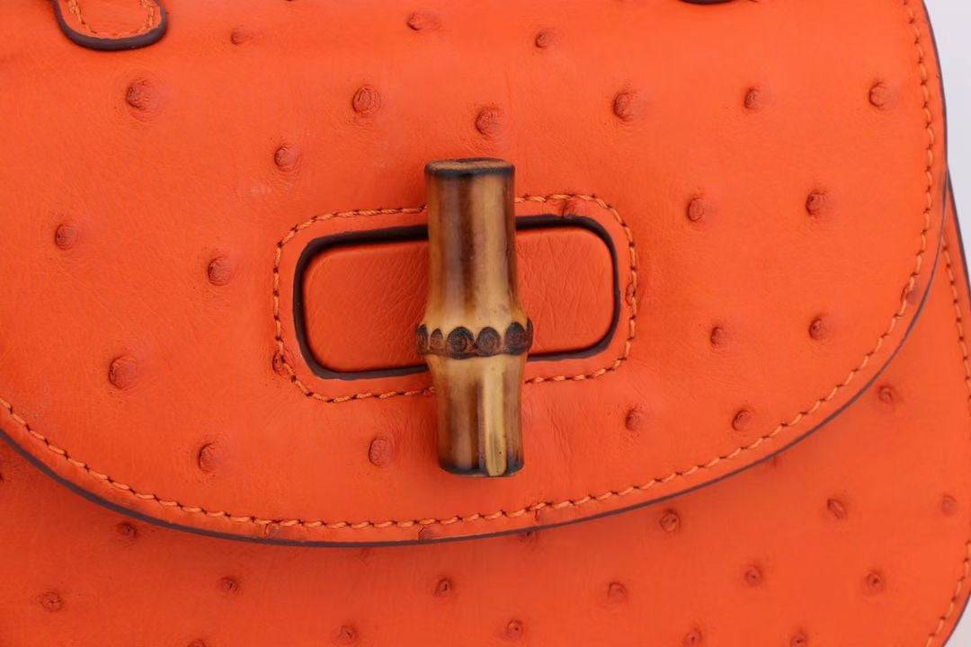 Rossie Viren ostrich leather nano bamboo top handle crossbody bag with adjustable strap and elegant design.