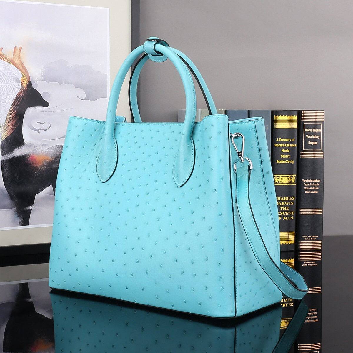 Blue Rossie Viren ostrich leather top handle shoulder bag, 32cm handbag with elegant design and textured finish.