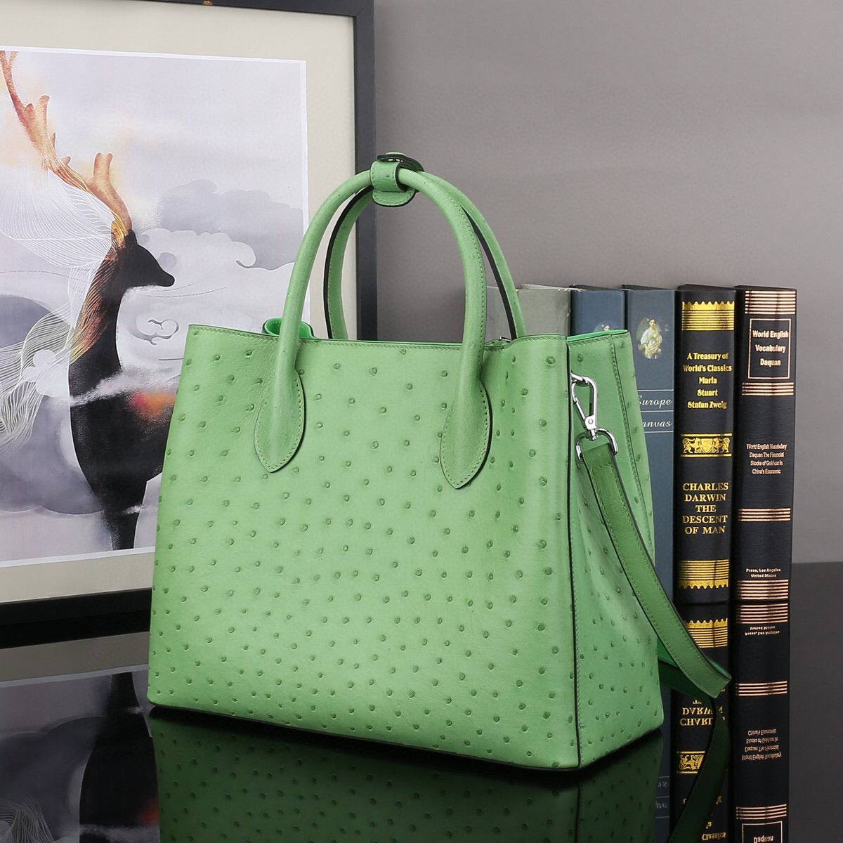 Green ostrich leather top handle shoulder bag by Rossie Viren, 32cm handbag with elegant design and textured surface.