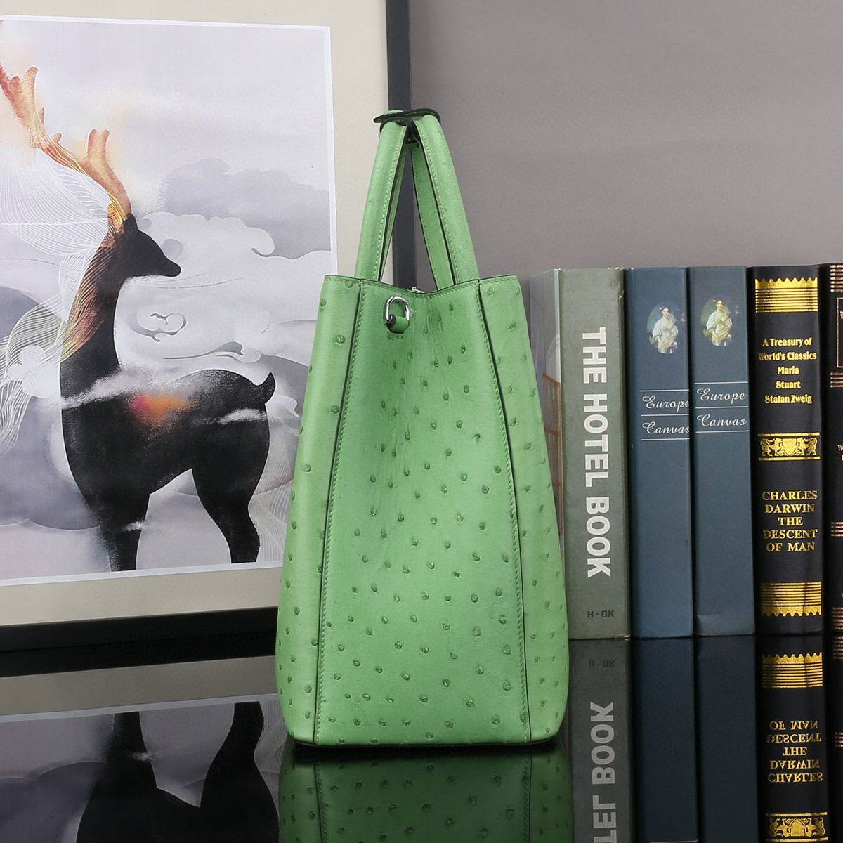Green ostrich leather top handle shoulder bag by Rossie Viren, 32cm handbag with elegant design and textured surface.