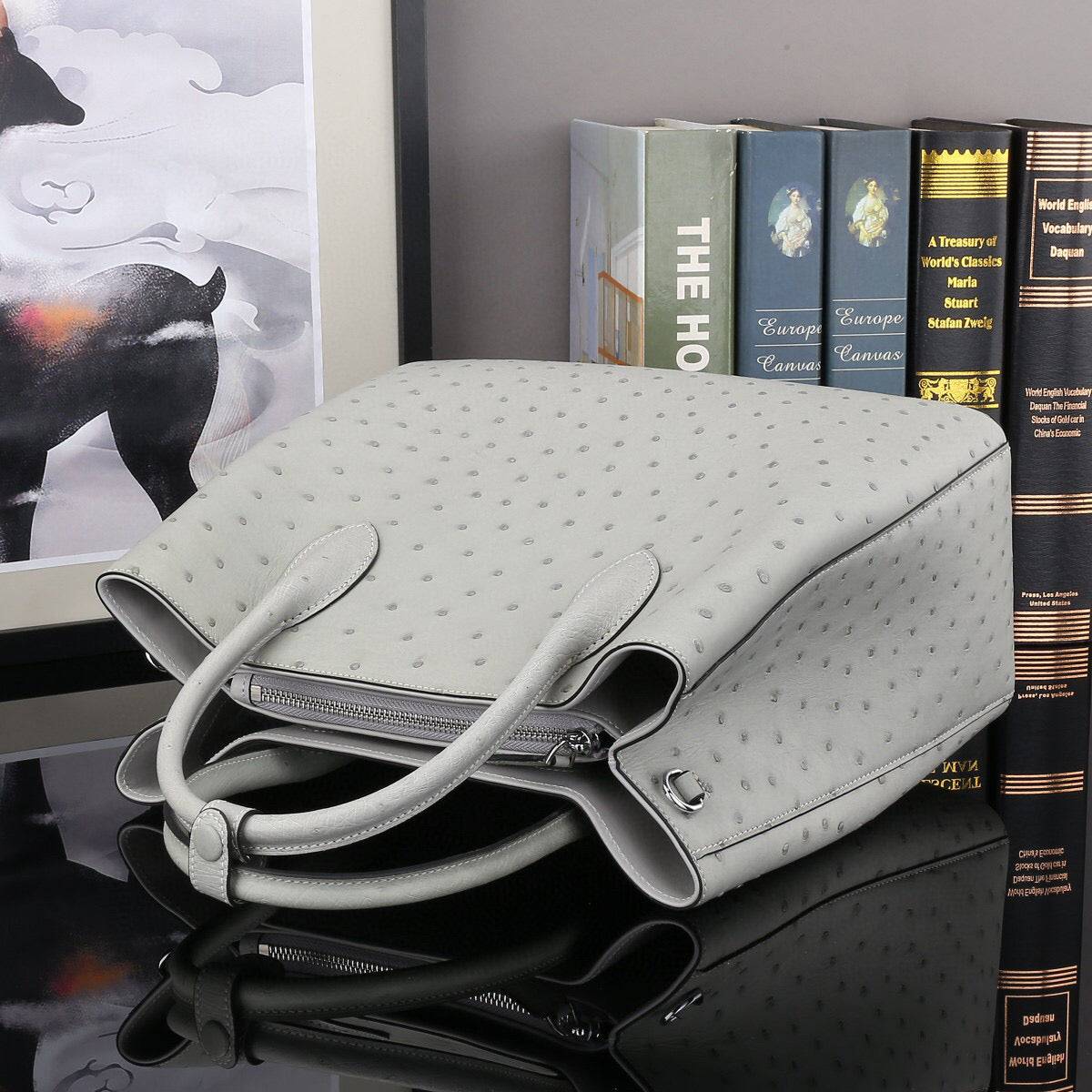 Grey ostrich leather handbag with top handle and shoulder strap, 32cm size, by Rossie Viren.