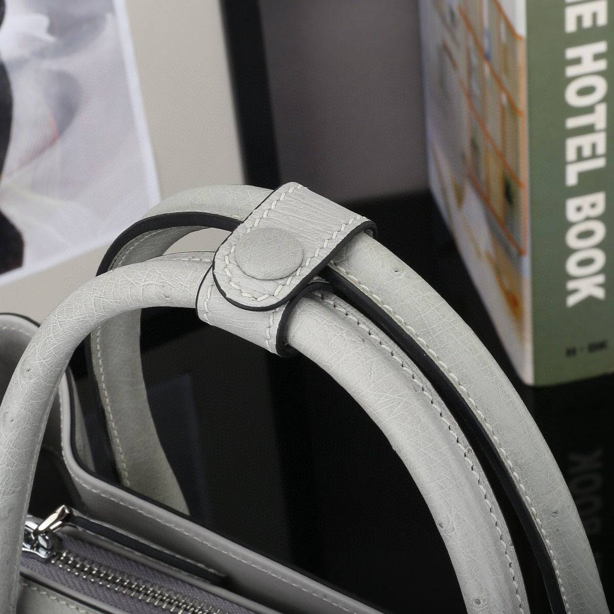 Grey ostrich leather top handle shoulder bag by Rossie Viren, 32cm handbag with elegant textured leather and structured design.